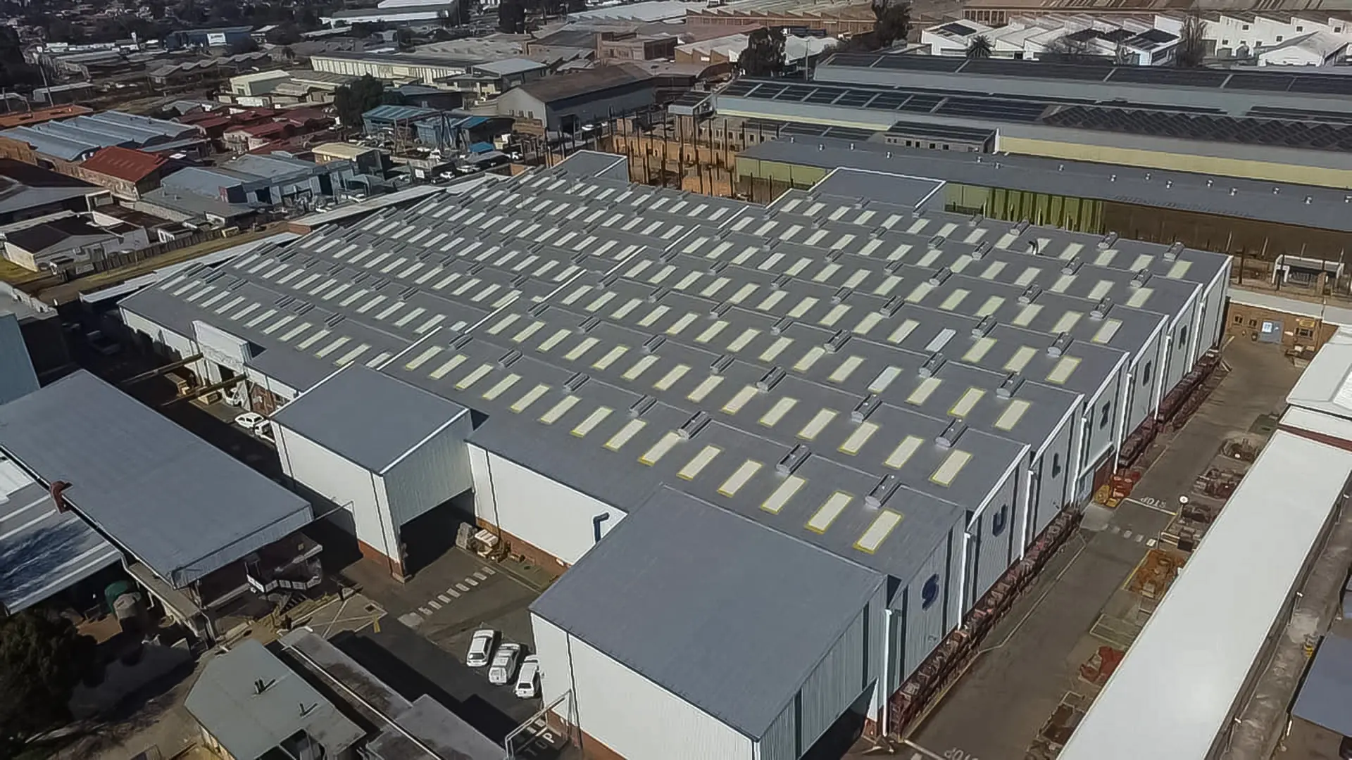 Sicon Group roofing engineers inspecting a large commercial metal roof in Gauteng